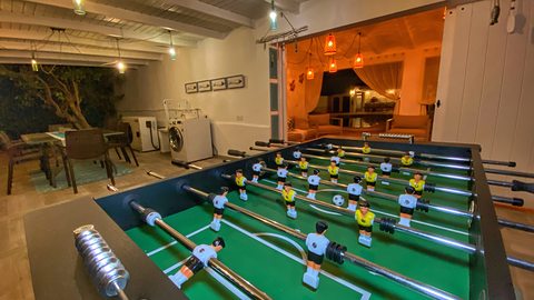 Table football under the lamps at night