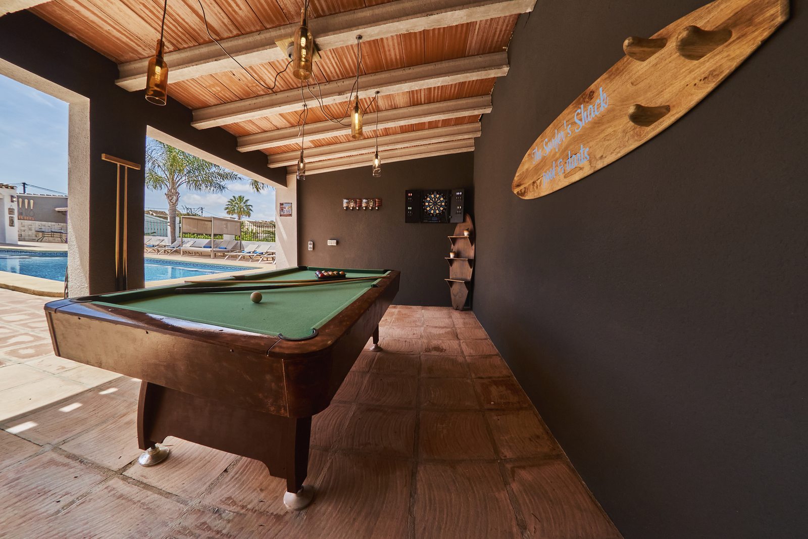 The billiard table under the surfboard