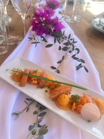 A sushi platter on the dressed table