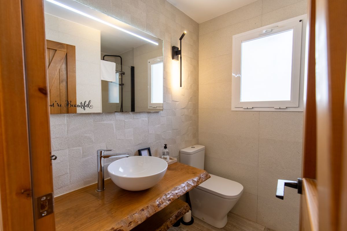 Bathroom with a wooden washstand — 20,000 Leagues Under the Sea, wing two of Villa Palmview, Jávea
