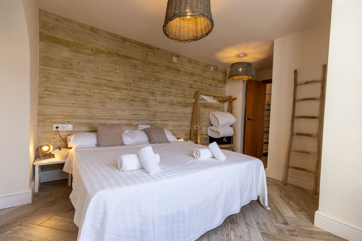 Bedroom with wooden wall and decorative ladder — 20,000 Leagues Under the Sea, wing two of Villa Palmview, Jávea