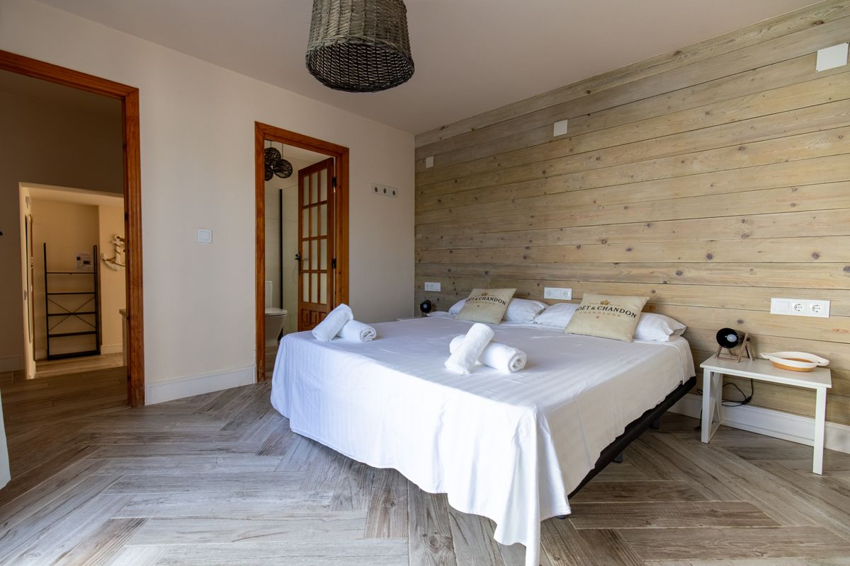 Bedroom with panelled wooden wall — 20,000 Leagues Under the Sea, wing two of Villa Palmview, Jávea
