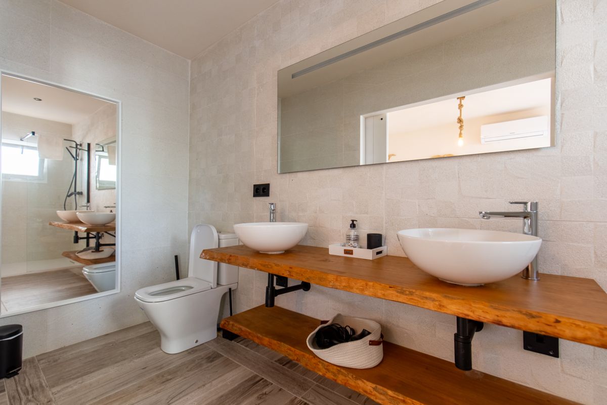 Bathroom with a wide mirrored wall — 20,000 Leagues Under the Sea, wing two of Villa Palmview, Jávea