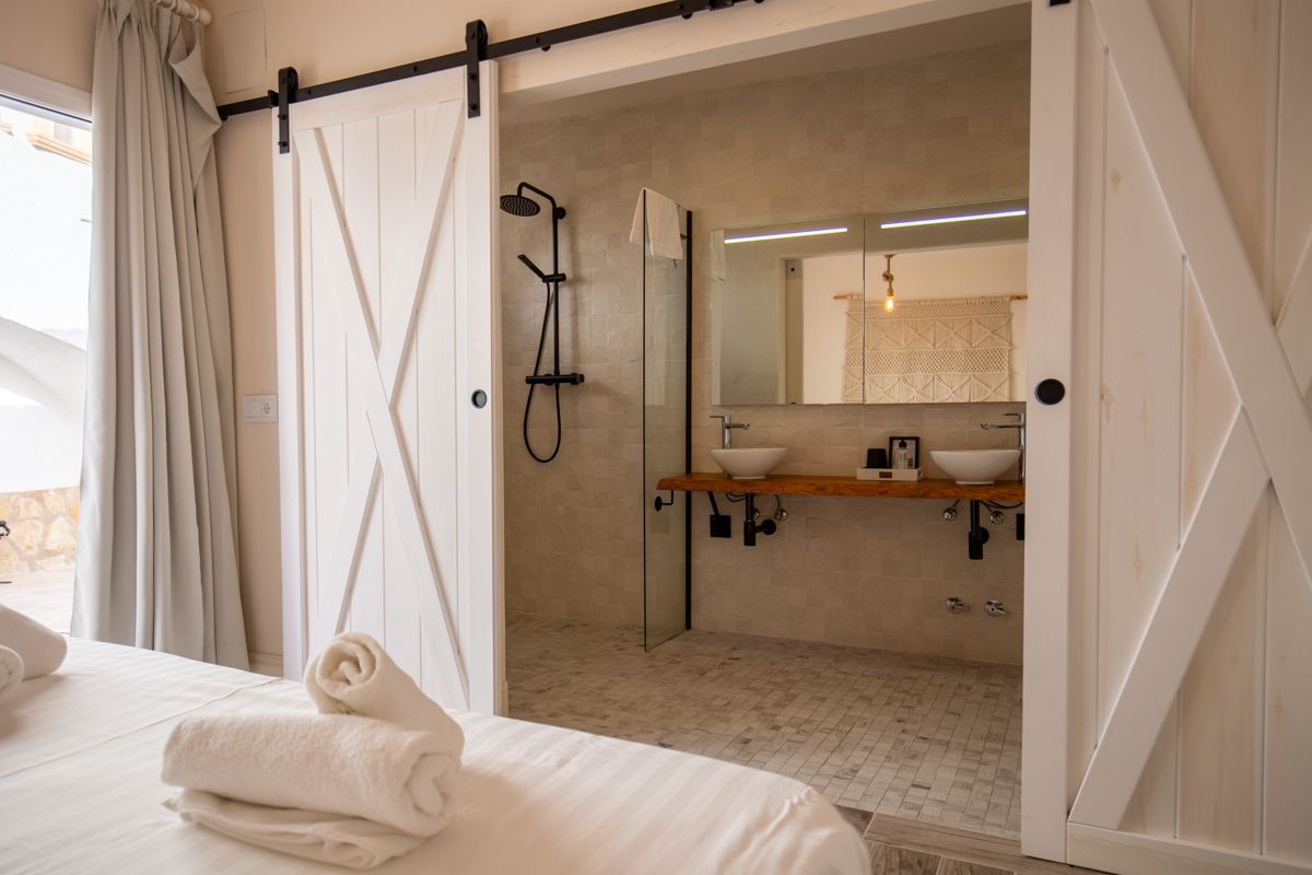 Bathroom behind a sliding door — 20,000 Leagues Under the Sea, wing two of Villa Palmview, Jávea