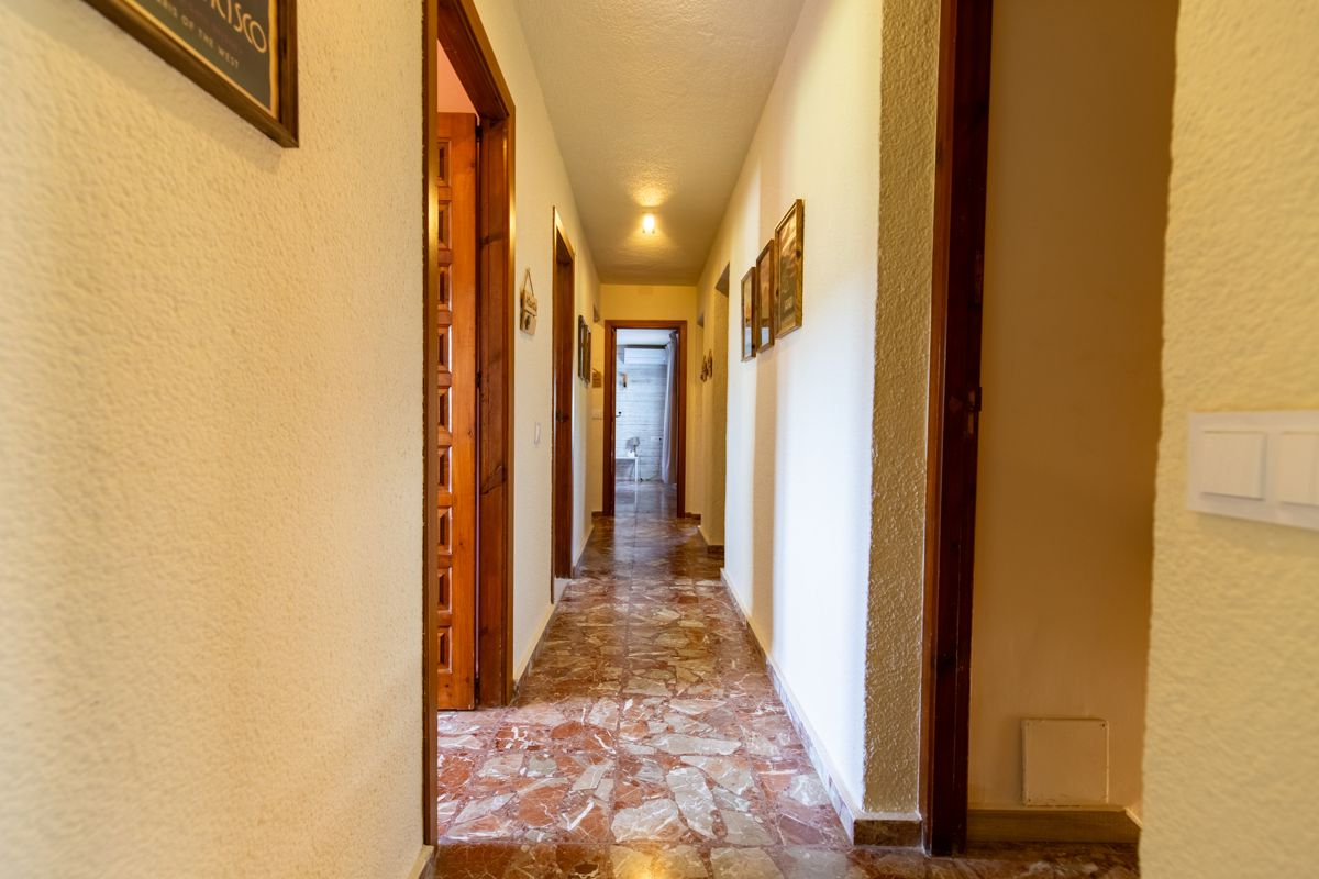Corridor with marble floor — Mystique Travels, wing three of Villa Palmview, Jávea