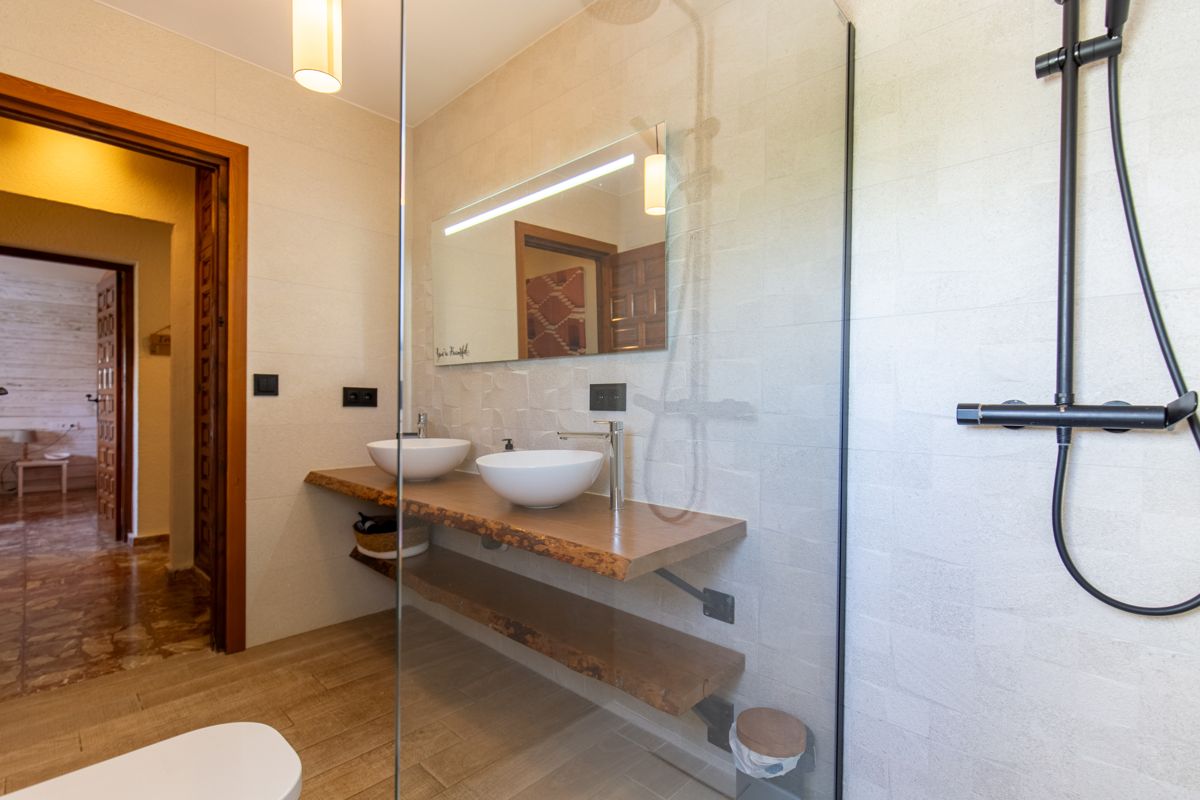 Bathroom with glass shower screen — Mystique Travels, wing three of Villa Palmview, Jávea