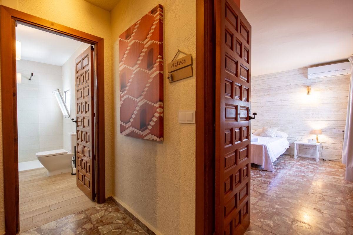 Bedroom looking through to the bathroom — Mystique Travels, wing three of Villa Palmview, Jávea