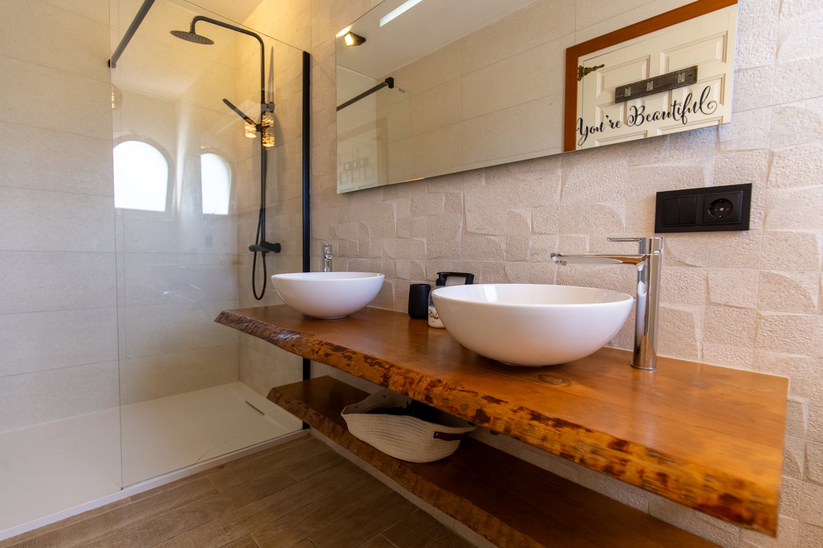 Bathroom with a wooden washstand — Mystique Travels, wing three of Villa Palmview, Jávea