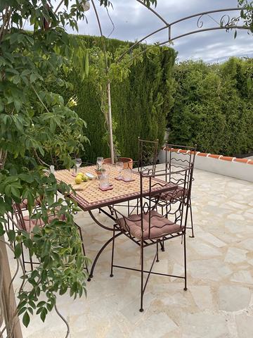 The pergola table in the late afternoon sun