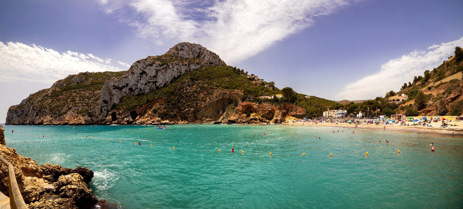 Turquoise water and the beach of Cala de la Granadella near Jávea, the turning point of ride 1 for cycling groups