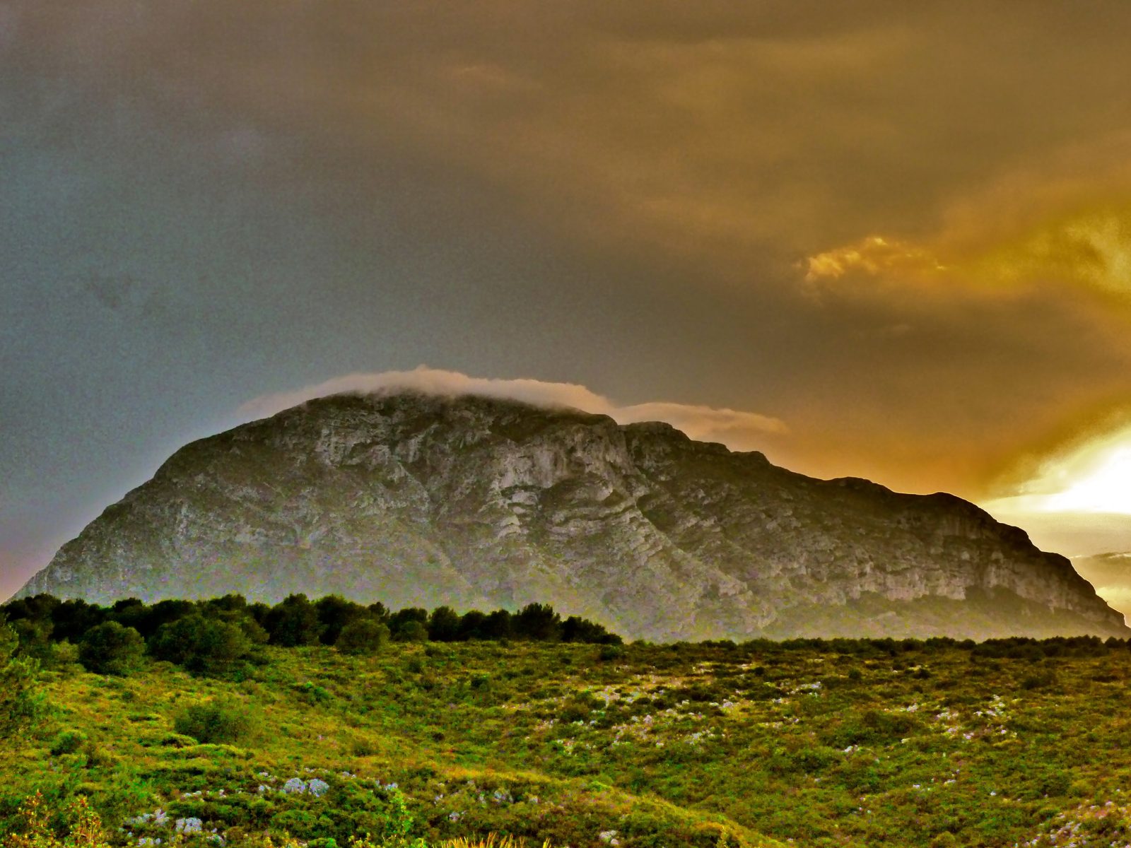 The Montgó above Jávea under a golden evening sky, seen from La Plana on the way back from Dénia