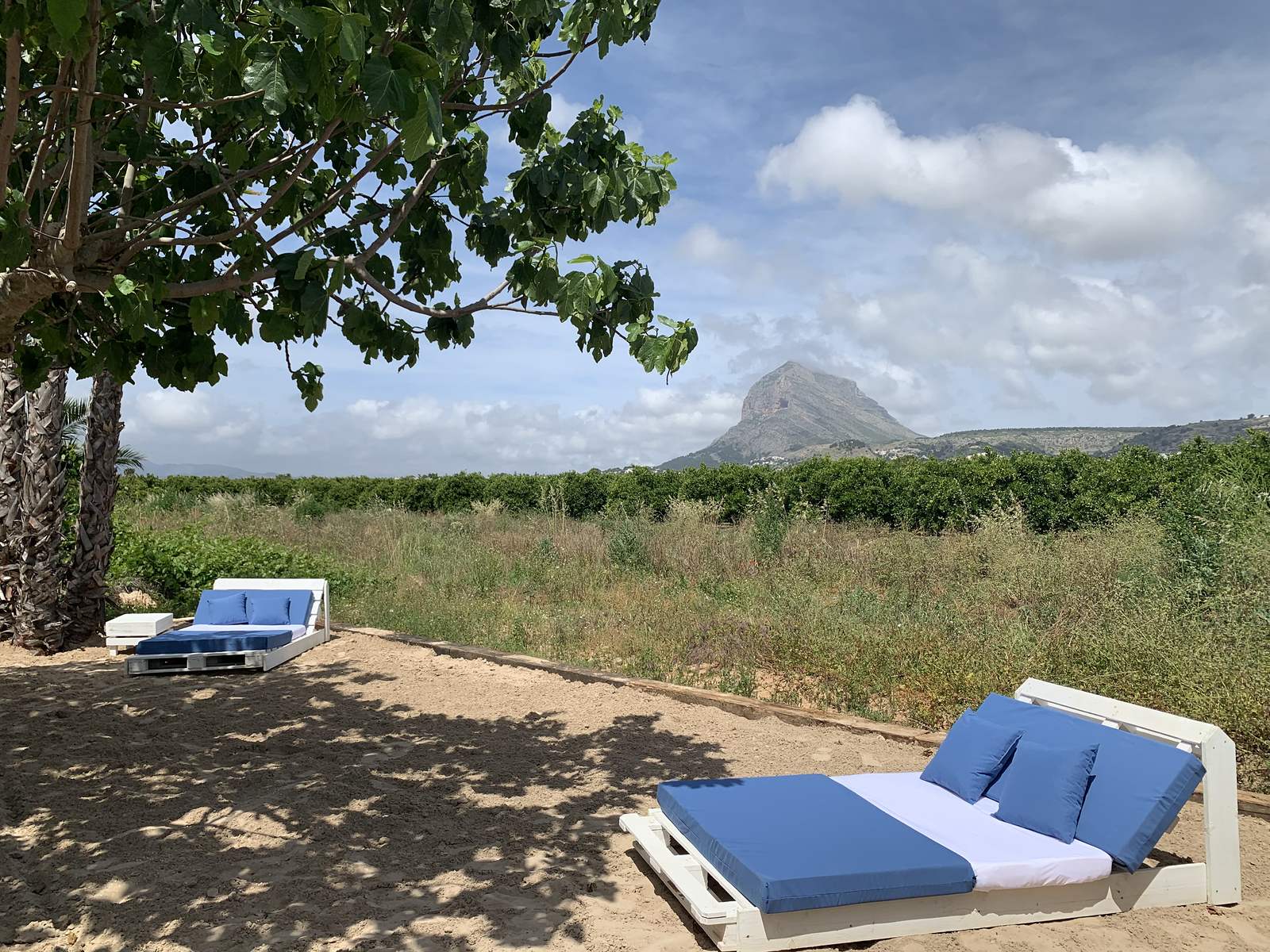 A daybed on the sand, the Montgó beyond