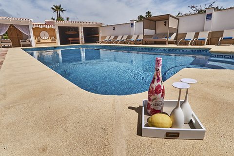 A chilled bottle at the edge of the pool